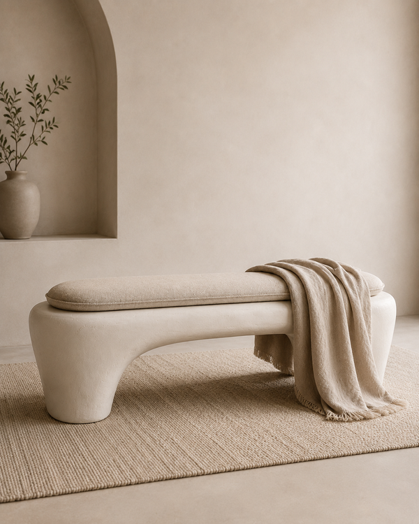 The curved arch form of the Wabi-Sabi Plaster Bench, hand-finished in mineral plaster