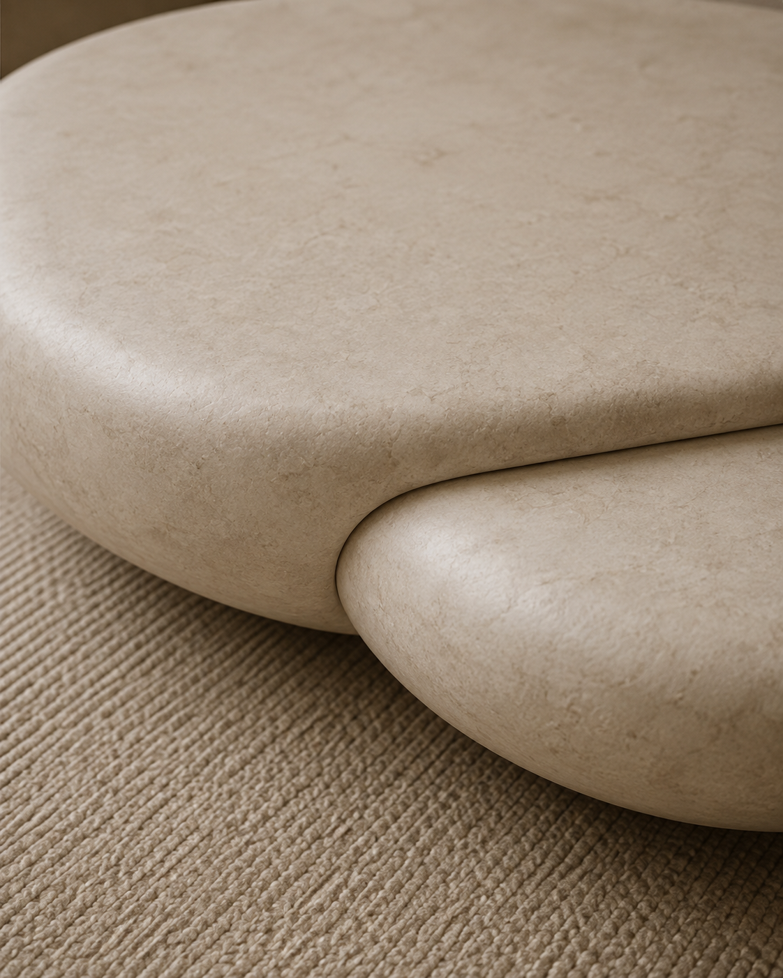 Close detail of the mineral plaster texture on the coffee table