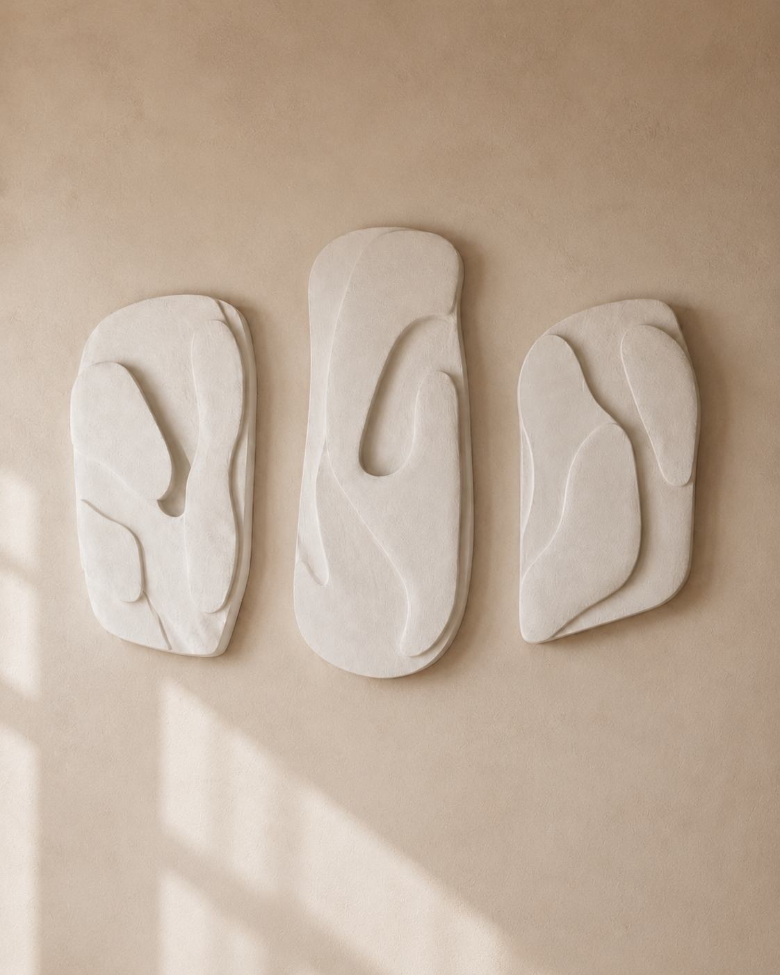 One panel from the Organic Triptych set, showing its flowing carved relief in matte plaster