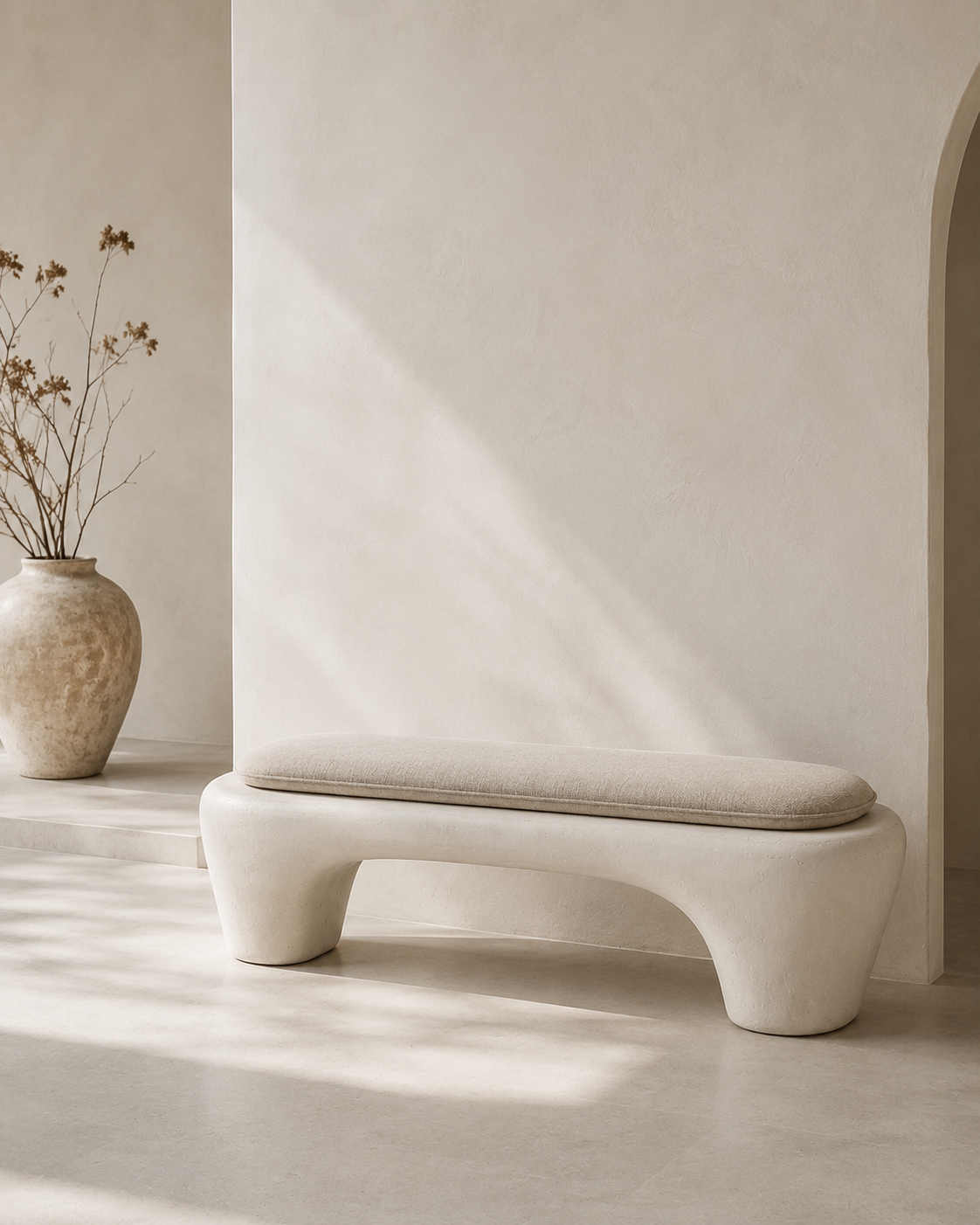 Wabi-Sabi Plaster Bench in warm white with its linen-look cushion in place
