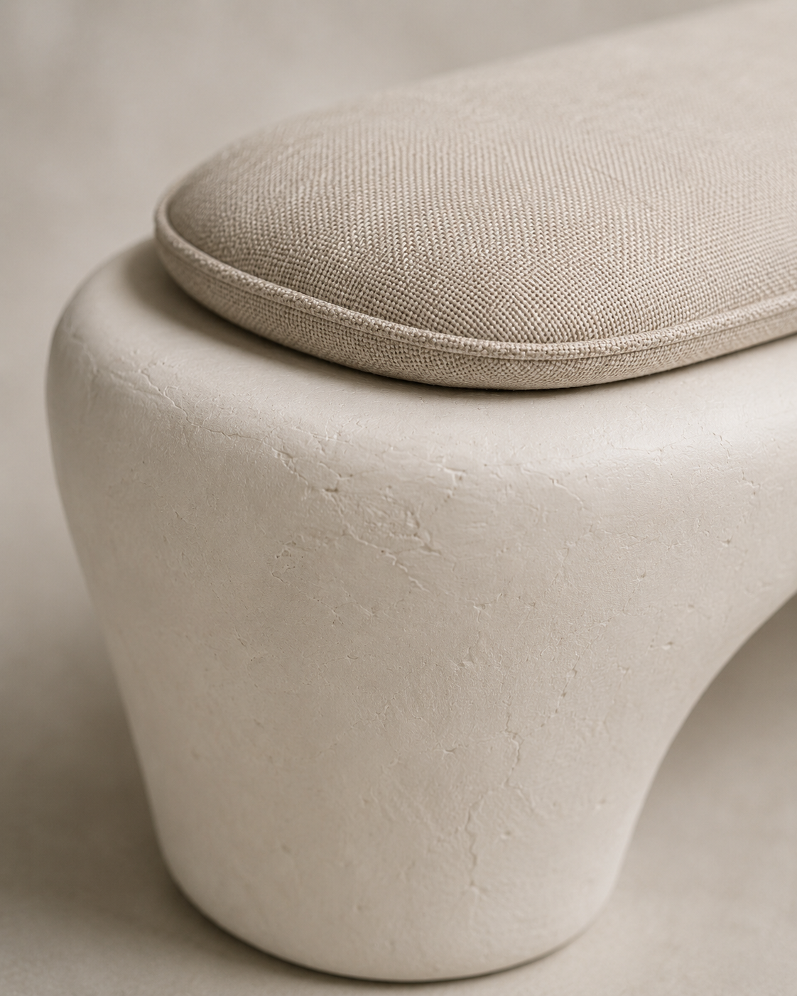The curved arch form of the Wabi-Sabi Plaster Bench, hand-finished in mineral plaster
