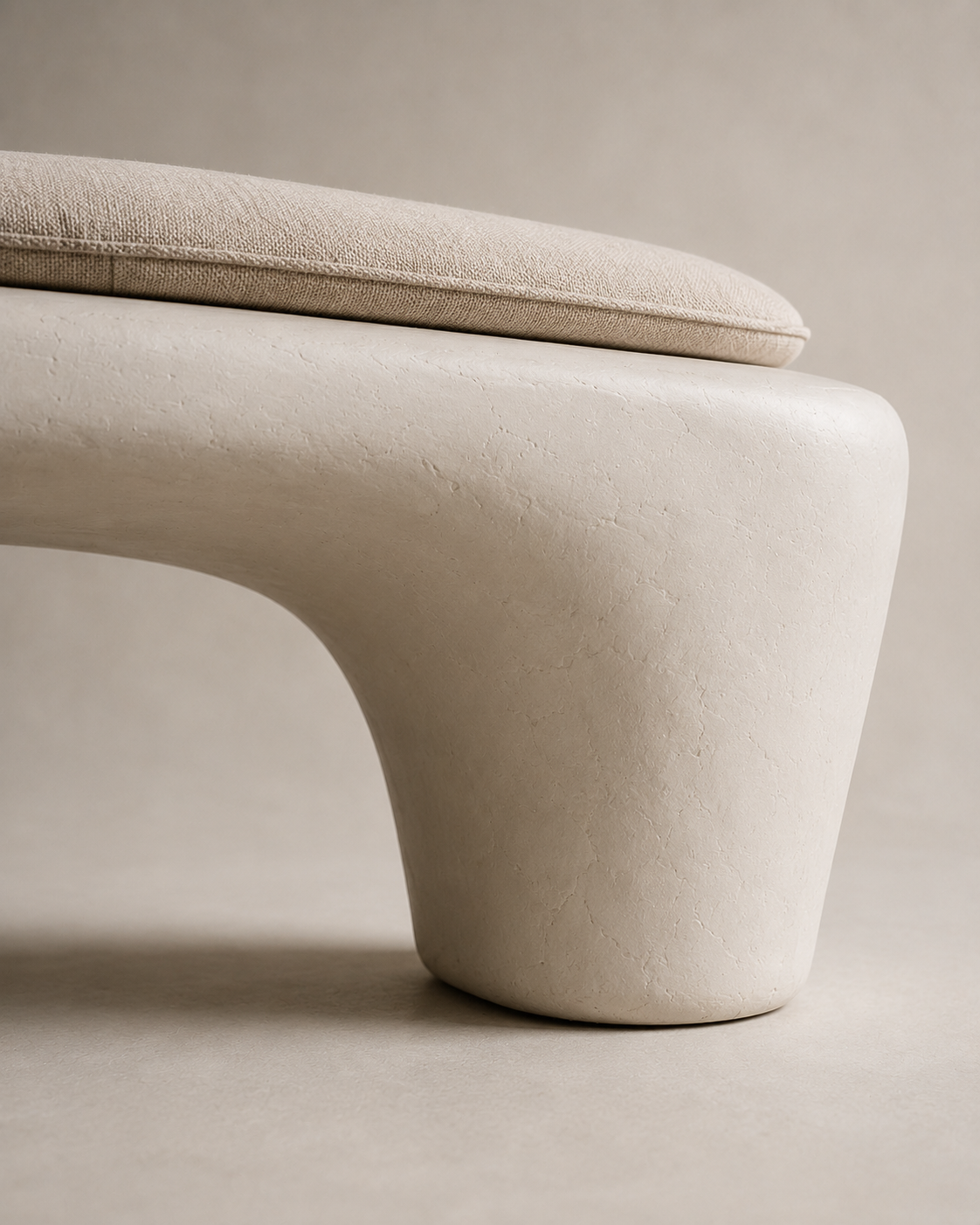 Wabi-Sabi Plaster Bench in warm white with its linen-look cushion in place
