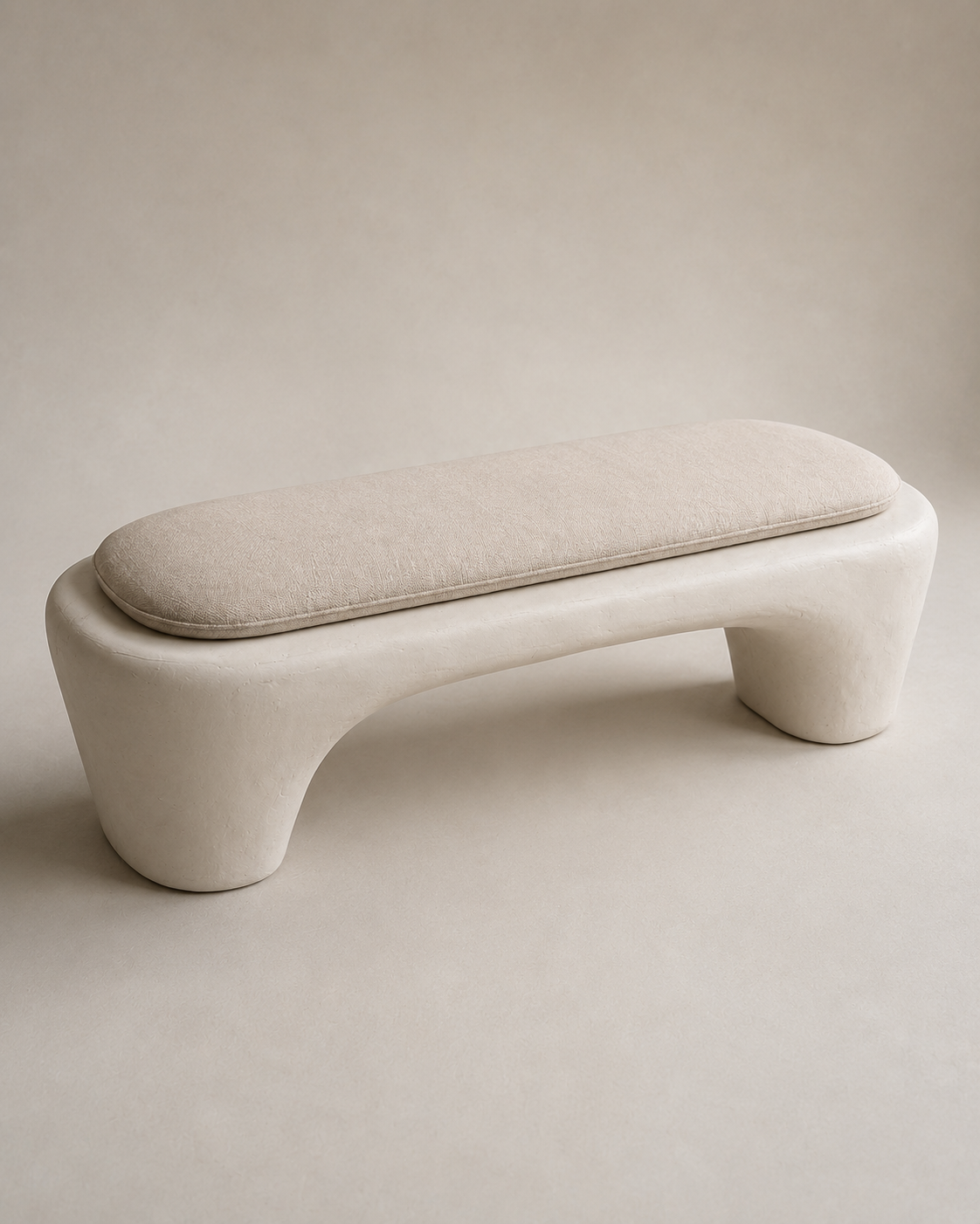 Detail of the hand-finished plaster surface and cushion edge on the Wabi-Sabi Plaster Bench