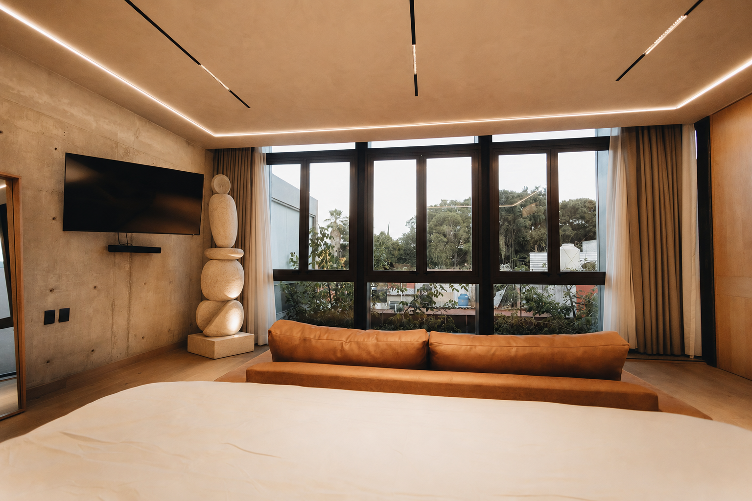 A Mono Aurel stone-look totem sculpture photographed in an interior space