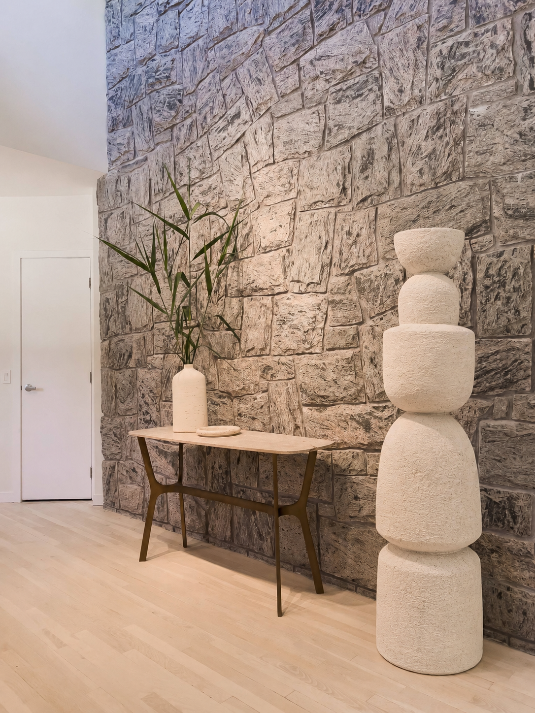 Minimal sculptural totem photographed in an interior setting